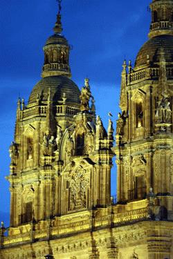 The evening lights shine on several outstanding churches in Salamanca